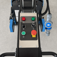 Thumbnail for Close-up view of the control panel on the Grizzly Grinders Pappa Bear planetary concrete floor grinder, featuring the power buttons, speed dial, emergency stop button, and industrial plug connection.