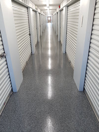 Thumbnail for Durable flake floor system in a commercial storage facility hallway using Labfast 85 (+) polyaspartic for a high-gloss, slip-resistant finish.