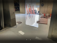 Thumbnail for A high-gloss white Labpox 35 epoxy floor installation in progress, showing the reflective finish and professional coating tools.