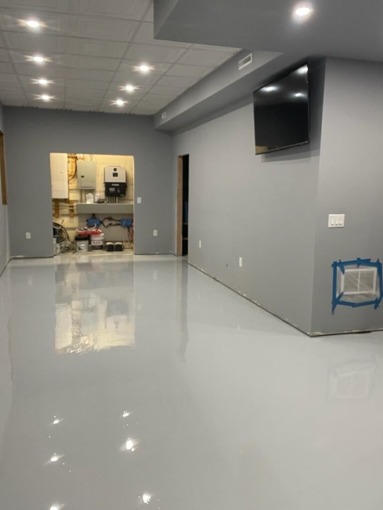 Professional light gray solid color epoxy floor in a modern, clean commercial space using LabSurface LABPOX 30