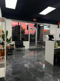 Thumbnail for High-gloss metallic epoxy floor in a modern office, featuring a custom blend of Stone Gray, Silver Gray, and Iron Silver pigments with a glass-like finish.
