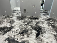 Thumbnail for Residential interior featuring a high-gloss white and black metallic epoxy floor with a marble-swirl finish