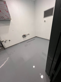 Thumbnail for Medium Gray self leveling industrial grade epoxy application on a large commercial floor, providing a high-gloss and chemical-resistant surface.