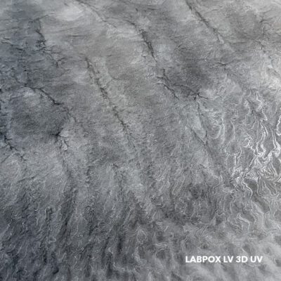 Close-up of a high-gloss silver and grey metallic epoxy floor featuring a deep 3D marble swirl finish using LABPOX LV 3D UV Ultra Low Viscosity Metallic Epoxy