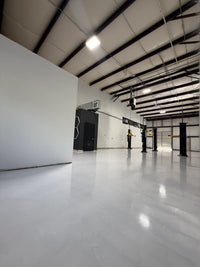 Thumbnail for Large industrial warehouse featuring a bright white floor coating system using  LABFENDER Aliphatic Polyurethane topcoat for maximum light reflectivity and abrasion resistance.