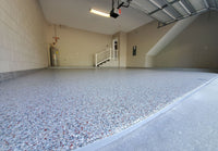 Thumbnail for Full flake epoxy garage flooring with a seamless self leveling resin foundation and decorative gray vinyl flakes