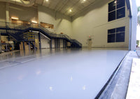 Thumbnail for Large industrial warehouse floor with a Lite Gray self leveling 100% solids epoxy coating for a seamless, high-gloss finish.