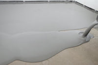 Thumbnail for Continuous pour of Lite Gray 100% solids self leveling epoxy resin, showing the excellent flow and leveling properties of the industrial system.